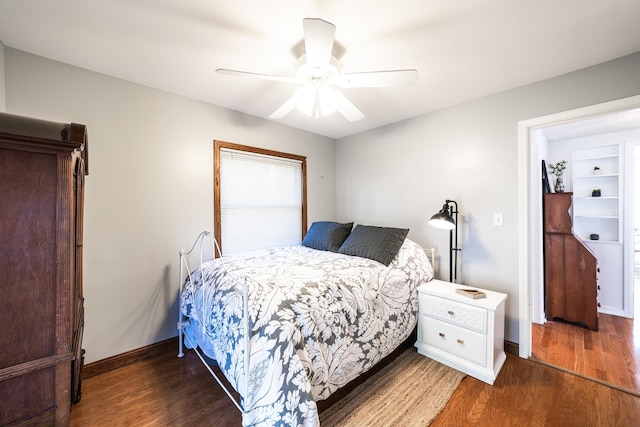 bedroom featuring dark wood-type flooring and ceiling fan