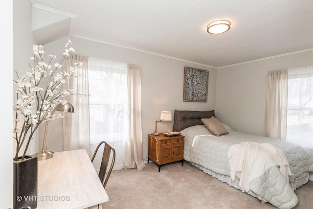 bedroom with ornamental molding and carpet flooring