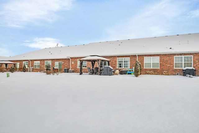 snow covered property featuring a gazebo