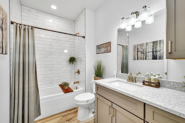 full bathroom featuring toilet, vanity, shower / bath combo, and hardwood / wood-style floors