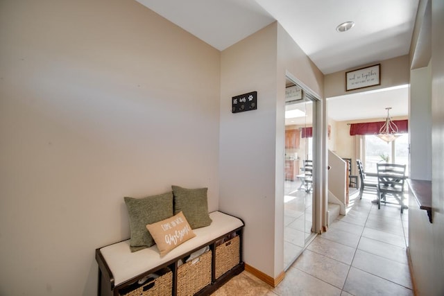 corridor featuring light tile patterned floors