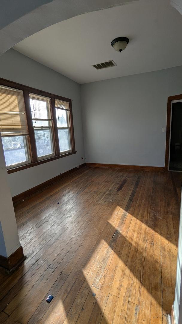 spare room featuring dark hardwood / wood-style flooring