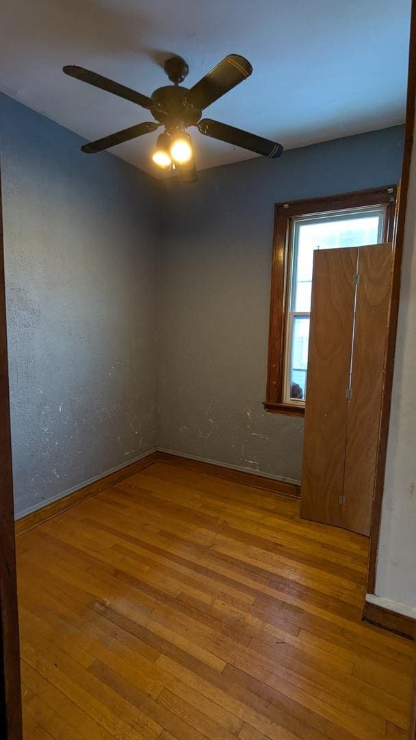 unfurnished room featuring wood-type flooring and ceiling fan