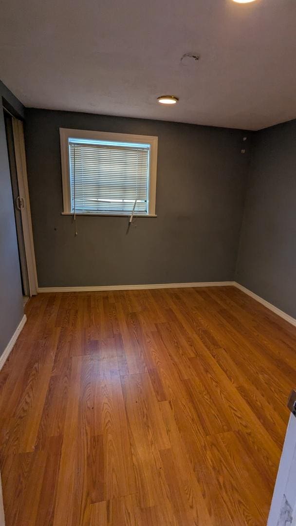 unfurnished room with light hardwood / wood-style flooring