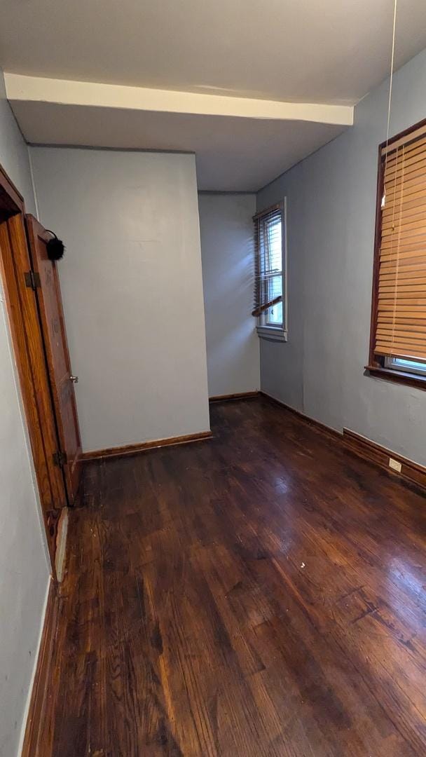 spare room featuring dark hardwood / wood-style floors