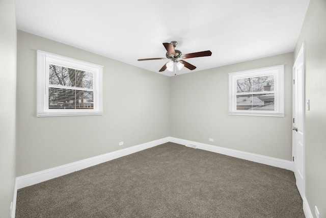 carpeted empty room featuring ceiling fan