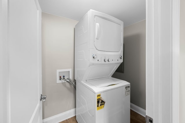 washroom with stacked washer and dryer