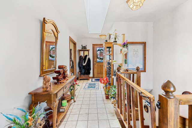 hall featuring light tile patterned floors