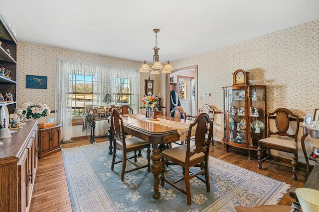 dining area featuring a chandelier and hardwood / wood-style flooring