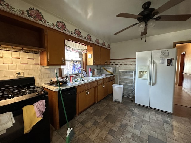 kitchen with sink, backsplash, ceiling fan, and black appliances