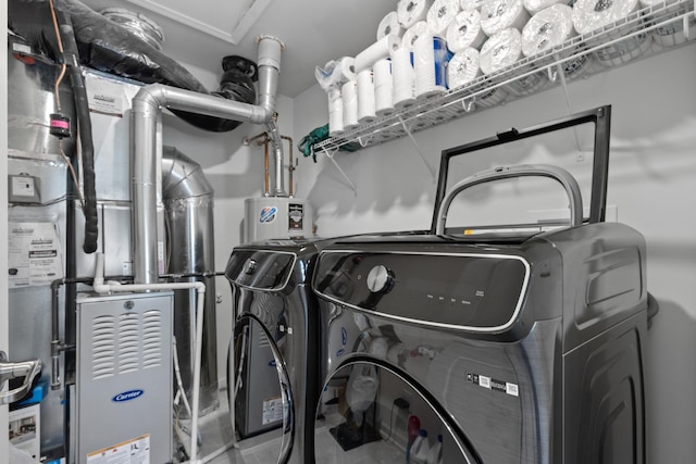 laundry room featuring washing machine and clothes dryer