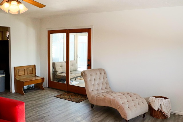 sitting room featuring ceiling fan and hardwood / wood-style flooring