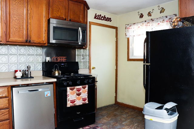 kitchen featuring black appliances and backsplash