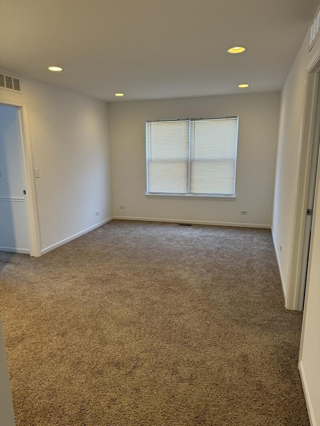 spare room with carpet