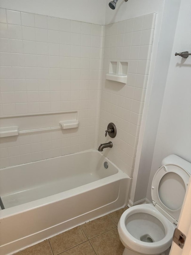 bathroom featuring toilet, tub / shower combination, and tile patterned floors