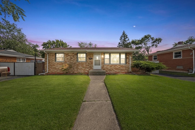 ranch-style house with a lawn