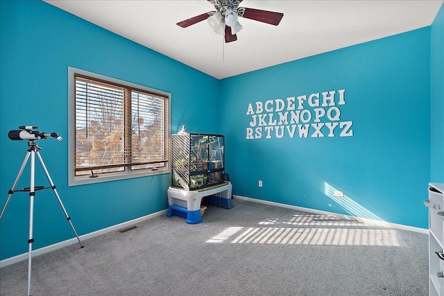 unfurnished room with carpet and ceiling fan