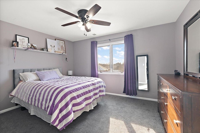 bedroom featuring ceiling fan and dark colored carpet