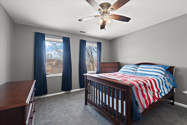 bedroom featuring ceiling fan and dark colored carpet