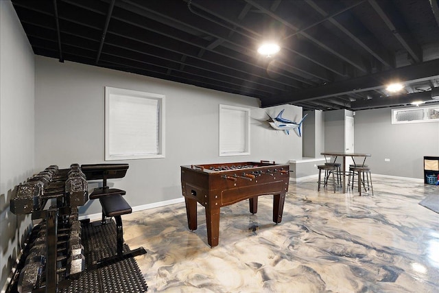 game room with concrete flooring