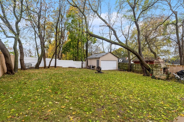 view of yard with an outbuilding and a garage