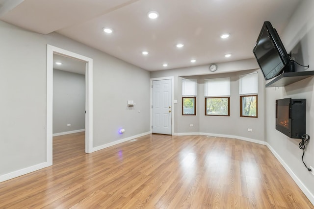 unfurnished living room with light hardwood / wood-style floors