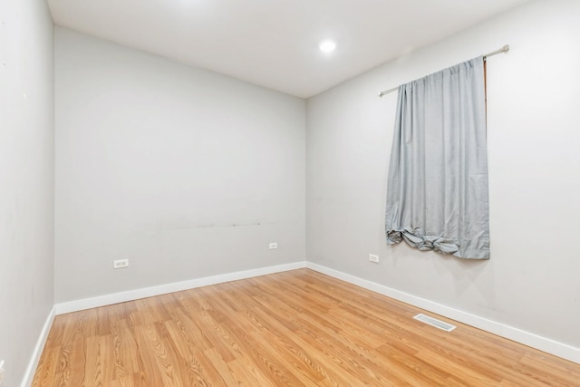 spare room featuring hardwood / wood-style floors