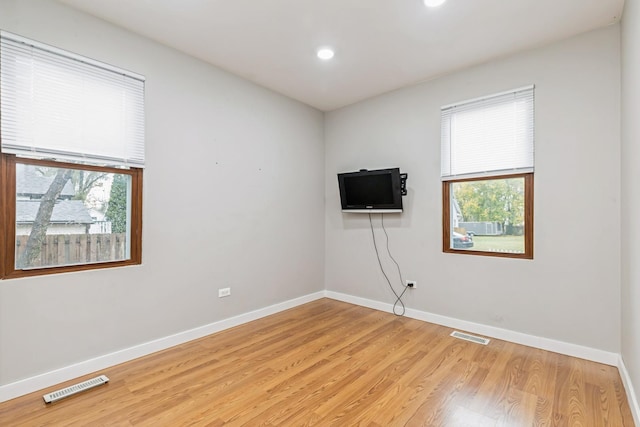 unfurnished room featuring light wood-type flooring