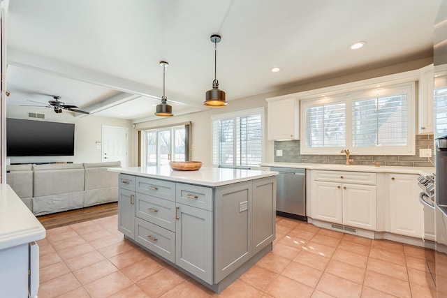 kitchen with backsplash, dishwasher, beamed ceiling, gray cabinetry, and white cabinets