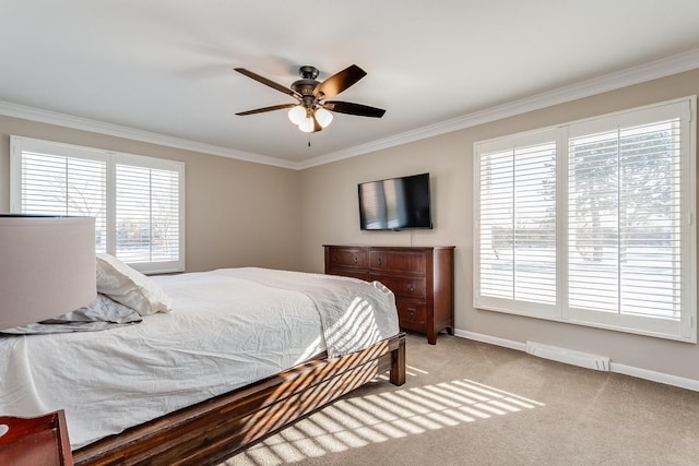 bedroom featuring ceiling fan, light colored carpet, and ornamental molding