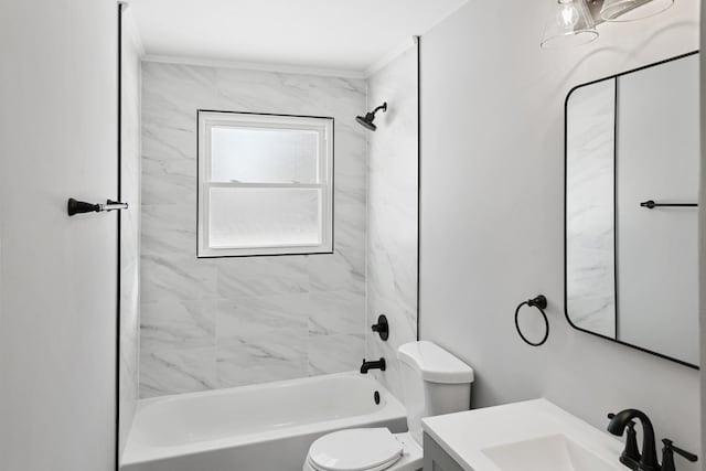 full bathroom featuring toilet, vanity, and tiled shower / bath