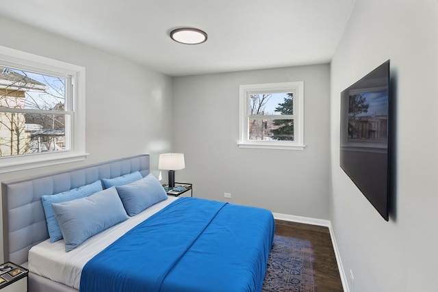 bedroom featuring dark wood-type flooring