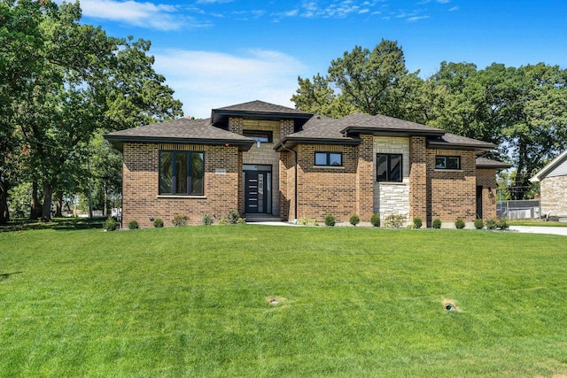 prairie-style home with a front yard