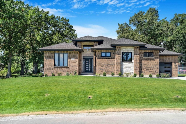 prairie-style house with a front lawn and a garage