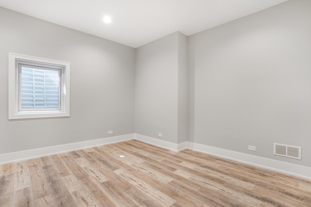 spare room featuring light wood-type flooring