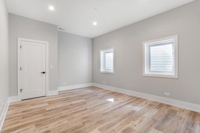 empty room with light wood-type flooring