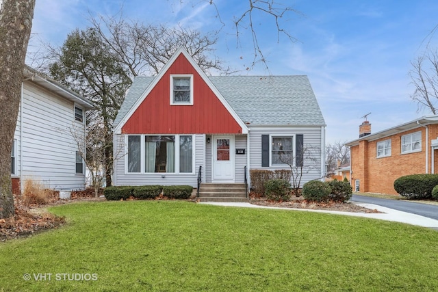 bungalow-style house featuring a front yard