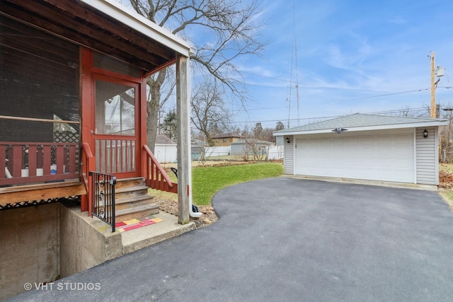 view of side of property featuring a garage and an outdoor structure