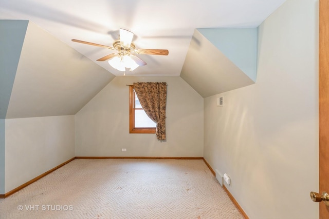 bonus room with ceiling fan, lofted ceiling, and light colored carpet