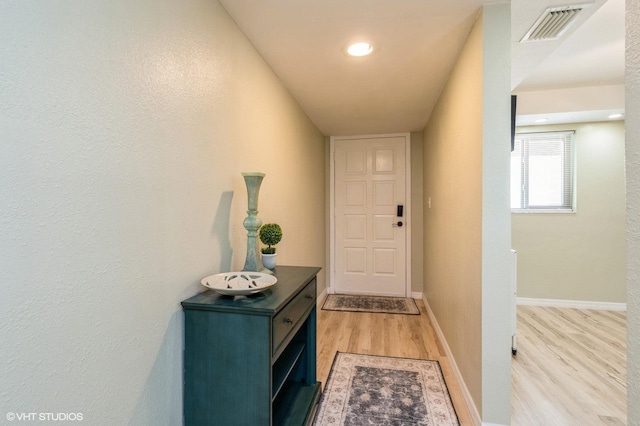 entryway with light hardwood / wood-style floors