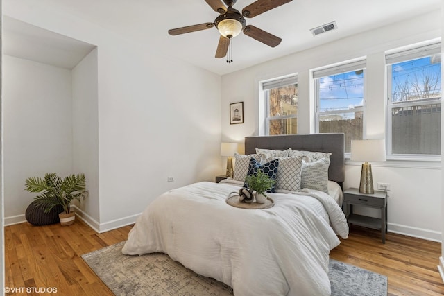 bedroom featuring ceiling fan and light hardwood / wood-style floors