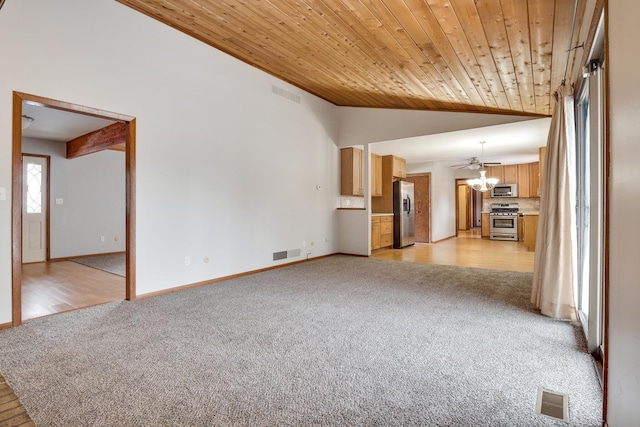 unfurnished living room featuring lofted ceiling, a notable chandelier, light carpet, and wood ceiling