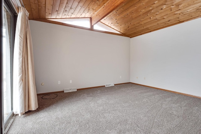 spare room with wooden ceiling, carpet floors, and lofted ceiling with beams