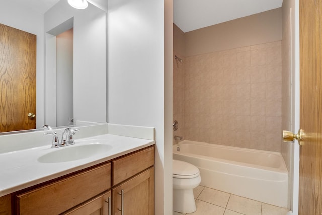 full bathroom featuring toilet, vanity, tiled shower / bath combo, and tile patterned flooring