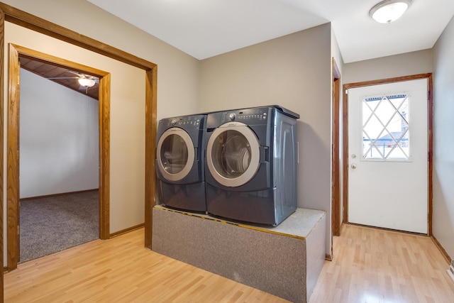 washroom featuring washer and dryer and light wood-type flooring