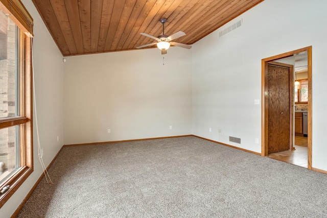 carpeted spare room with vaulted ceiling, ceiling fan, and wood ceiling