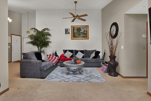 living room featuring light carpet and ceiling fan