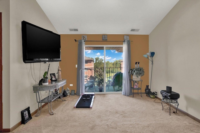 interior space with carpet floors and vaulted ceiling