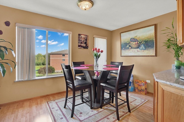 dining area with light wood-type flooring