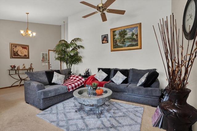 living room with carpet floors and ceiling fan with notable chandelier